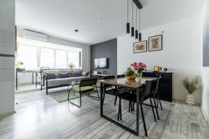 a living room with a table and a couch at Apartman Marija in Zagreb