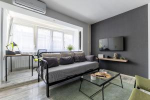 a living room with a couch and a table at Apartman Marija in Zagreb