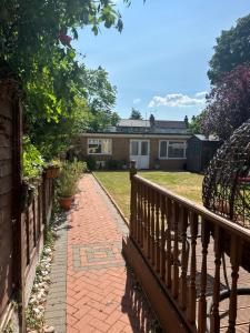 a brick walkway in front of a house at Studio flat Gants Hill with Free Parking in Redbridge