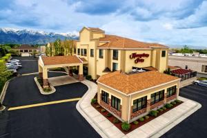 an aerial view of a hotel with a parking lot at Hampton Inn Salt Lake City-Layton in Layton