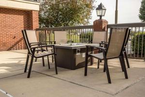 two chairs and a table on a patio at Hampton Inn Somerset in Somerset