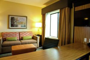 a living room with a couch and a table at Hampton Inn & Suites Salinas in Salinas