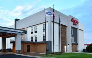 a building with two flags in front of it at Hampton Inn Santee-I-95 in Santee