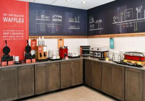 a kitchen with a counter with many appliances on it at Hampton Inn Santee-I-95 in Santee