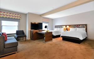 a large hotel room with two beds and a desk at Hampton Inn Santee-I-95 in Santee