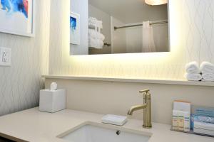 a bathroom with a sink and a mirror and towels at Hampton Inn Santee-I-95 in Santee