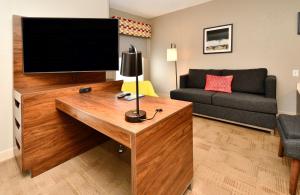 a living room with a flat screen tv and a couch at Hampton Inn Santee-I-95 in Santee