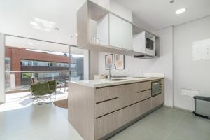 Kuhinja oz. manjša kuhinja v nastanitvi PORTANOVA Suites by ADVENTU