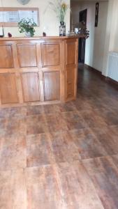 a room with wooden cabinets and a hard wood floor at SC Pati-Com FLOREX SRL - CASA ADELA in Tulcea +23 photos