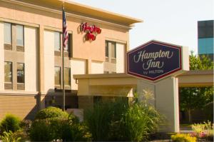 a hampton inn sign in front of a building at Hampton Inn St. Louis-Chesterfield in Chesterfield
