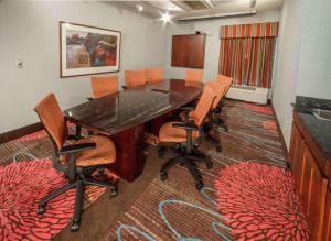 a conference room with a wooden table and chairs at Hampton Inn South Haven in South Haven +30 photos