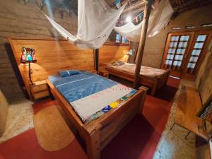an overhead view of a bedroom with a bed and a canopy at Mountain Bikes House in Moshi