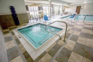 a pool with a hot tub in a hotel room at Hampton Inn & Suites Toledo/Westgate in Toledo