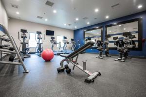 a gym with a lot of machines and a red ball at Hampton Inn & Suites Toledo/Westgate in Toledo