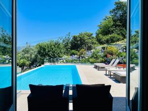 a view of a swimming pool from a house at Solar Do Douro in Santa Cruz do Douro