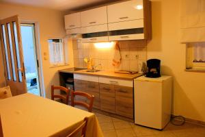Kuchyň nebo kuchyňský kout v ubytování Apartment Marko