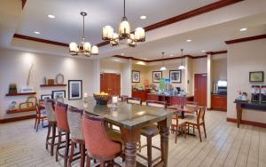 a dining room and kitchen with a table and chairs at Hampton Inn Tremonton in Tremonton