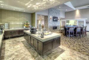 a large kitchen with a large island in a room at Homewood Suites by Hilton Victoria in Victoria