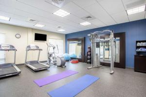 a gym with two treadmills and exercise machines at Hampton Inn Philadelphia/Voorhees in Voorhees
