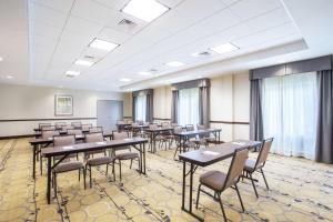 a classroom with tables and chairs in a room with windows at Hampton Inn Philadelphia/Voorhees in Voorhees +18 photos