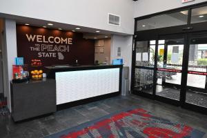 a welcome to the beach state sign in a lobby at Hampton Inn Valdosta/Lake Park Area in Lake Park