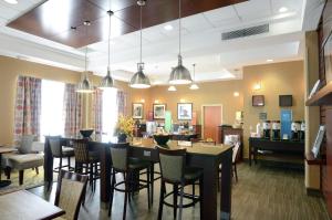 a waiting room at a pharmacy with chairs and tables at Hampton Inn Vidalia in Vidalia