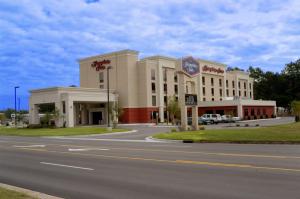 a large building on the side of a road at Hampton Inn Washington in Washington