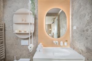 a bathroom with a sink and a mirror at Eagle's Nest Ljubljana in Ljubljana