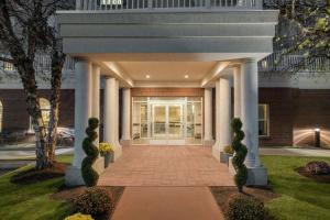 a front entrance to a building with columns at Homewood Suites by Hilton Providence-Warwick in Warwick