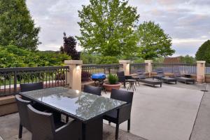 a patio with a table and chairs and a fence at Hampton Inn Wytheville in Wytheville