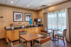 a kitchen with a table and a dining room at Hampton Inn Wilkesboro in Wilkesboro