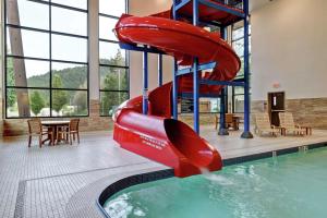 a water slide in a swimming pool with a water slide at Hampton Inn by Hilton Chilliwack in Chilliwack