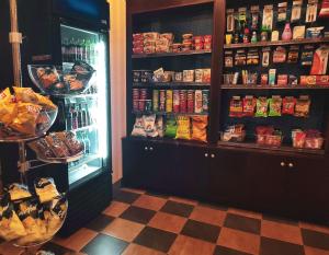 a store with a refrigerator filled with lots of food at Hampton Inn & Suites by Hilton Edmonton International Airport in Leduc