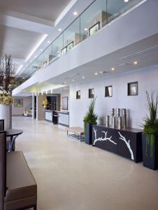 a lobby of a hospital with plants on the walls at Homewood Suites by Hilton Hamilton in Hamilton