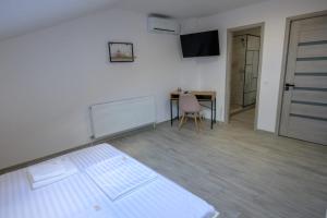 Postel nebo postele na pokoji v ubytování Vila RD