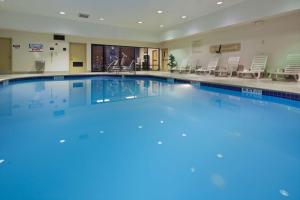 a large swimming pool with blue water at Hampton Inn Youngstown-North in Youngstown