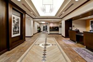 a hallway with a tile floor in a building at Hampton Inn by Hilton Toronto Airport Corporate Centre in Toronto