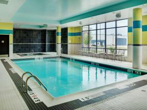 a large swimming pool in a hotel room at Hampton Inn by Hilton Winnipeg in Winnipeg