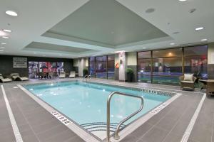 a large swimming pool in a hotel lobby at Hampton Inn & Suites by Hilton Toronto Markham in Markham