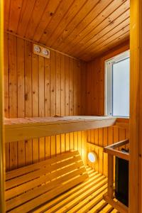 a sauna with a bench in a wooden cabin at Center PENTHOUSE apartment - HUGE TERRACE and FREE PARKING - Tram/Metro - AC in Budapest