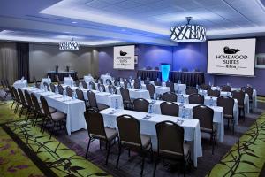 a conference room with white tables and chairs at Homewood Suites by Hilton Toronto Vaughan in Vaughan