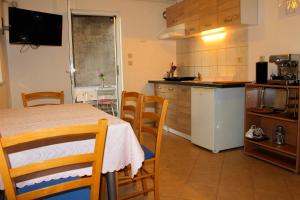 Kuchyň nebo kuchyňský kout v ubytování Apartment Marko