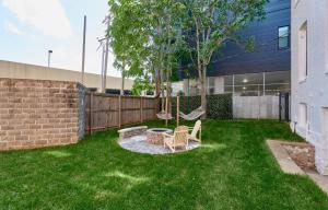 a backyard with a hammock and a swing at White House at Grand Central in Tower Grove