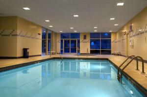 a large swimming pool with blue water at Hilton Atlanta Airport in Atlanta