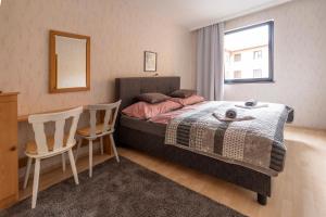 A bed or beds in a room at Máté Pension