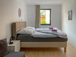 A bed or beds in a room at Máté Pension