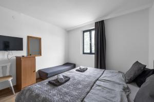 A bed or beds in a room at Máté Pension