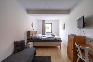 A bed or beds in a room at Máté Pension