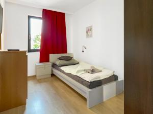 A bed or beds in a room at Máté Pension