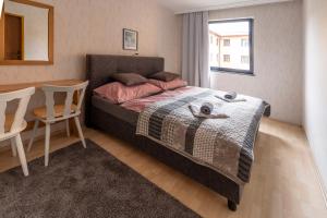 A bed or beds in a room at Máté Pension